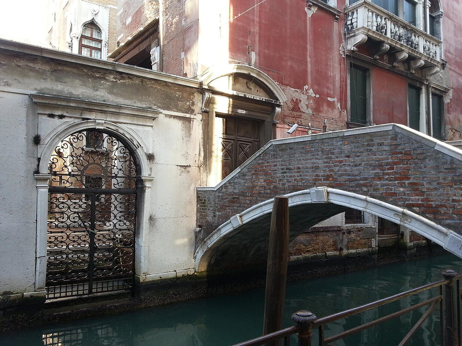 The cast iron gate and the private bridge on the canal side