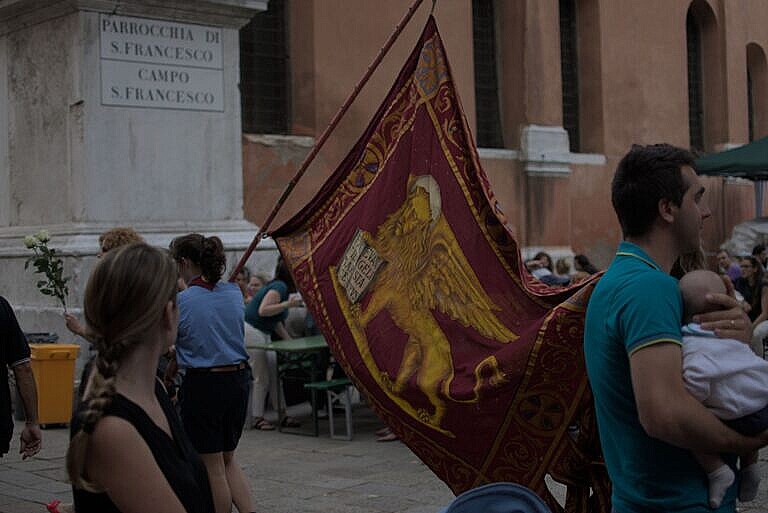 The winged lion of San Marco on the gonfalone at an event in Venice