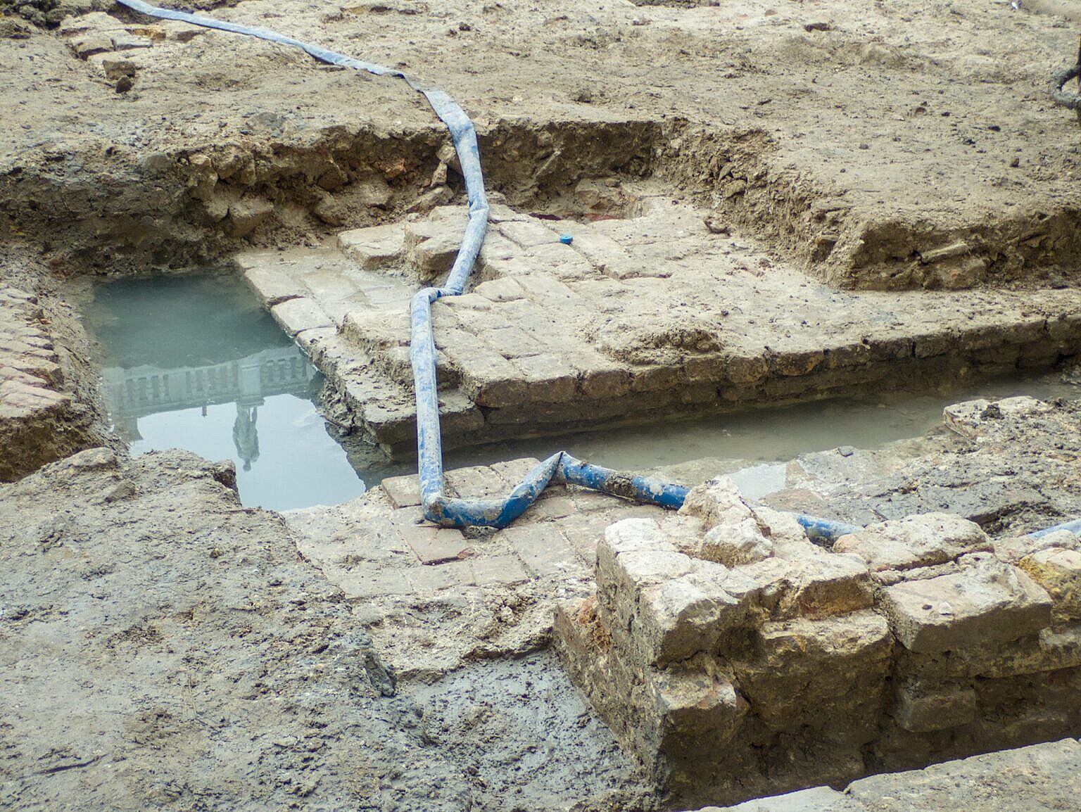 Remains of older pavings in red brick in Piazza San Marco