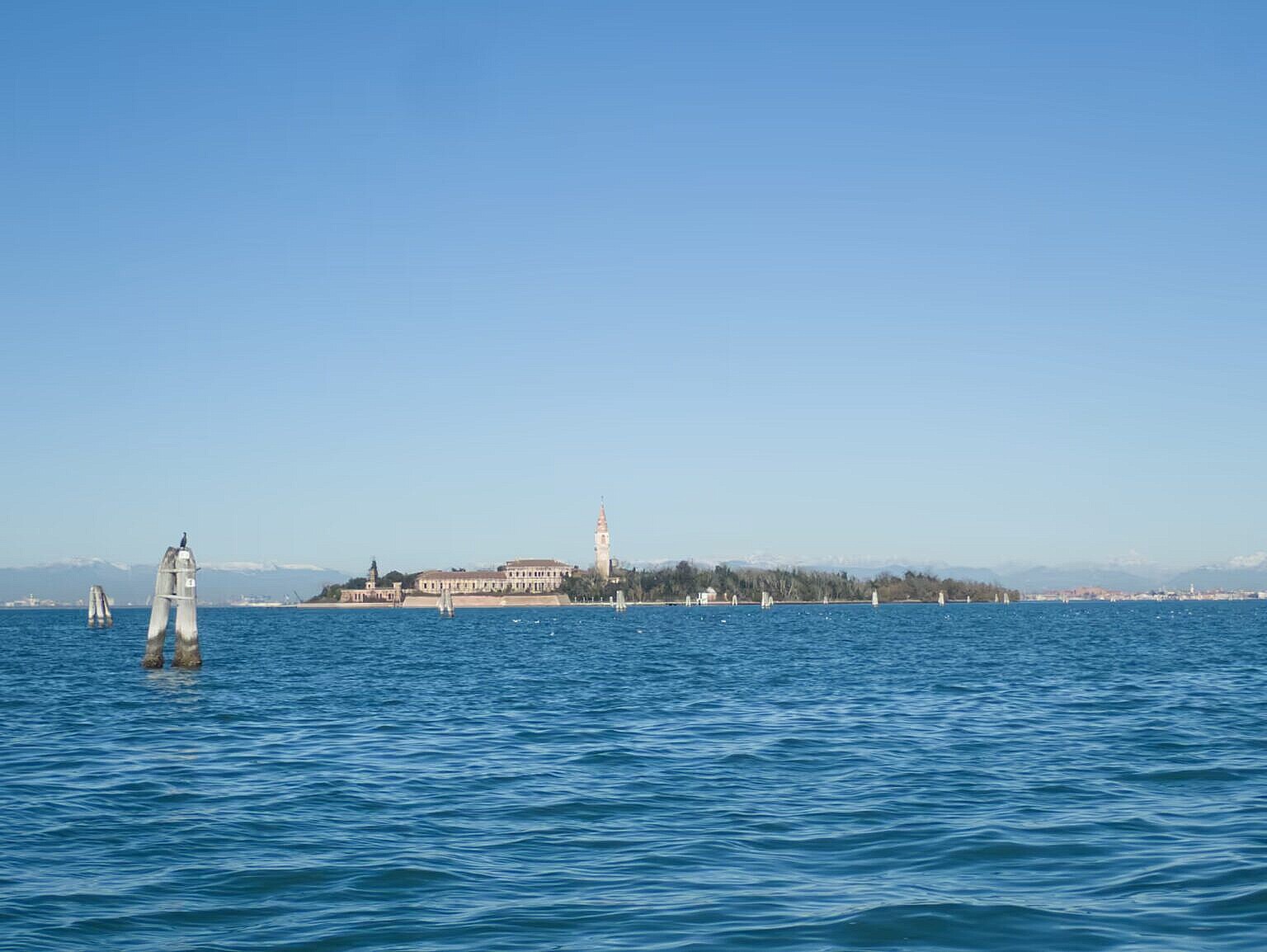 The island of Poveglia with Venice the background