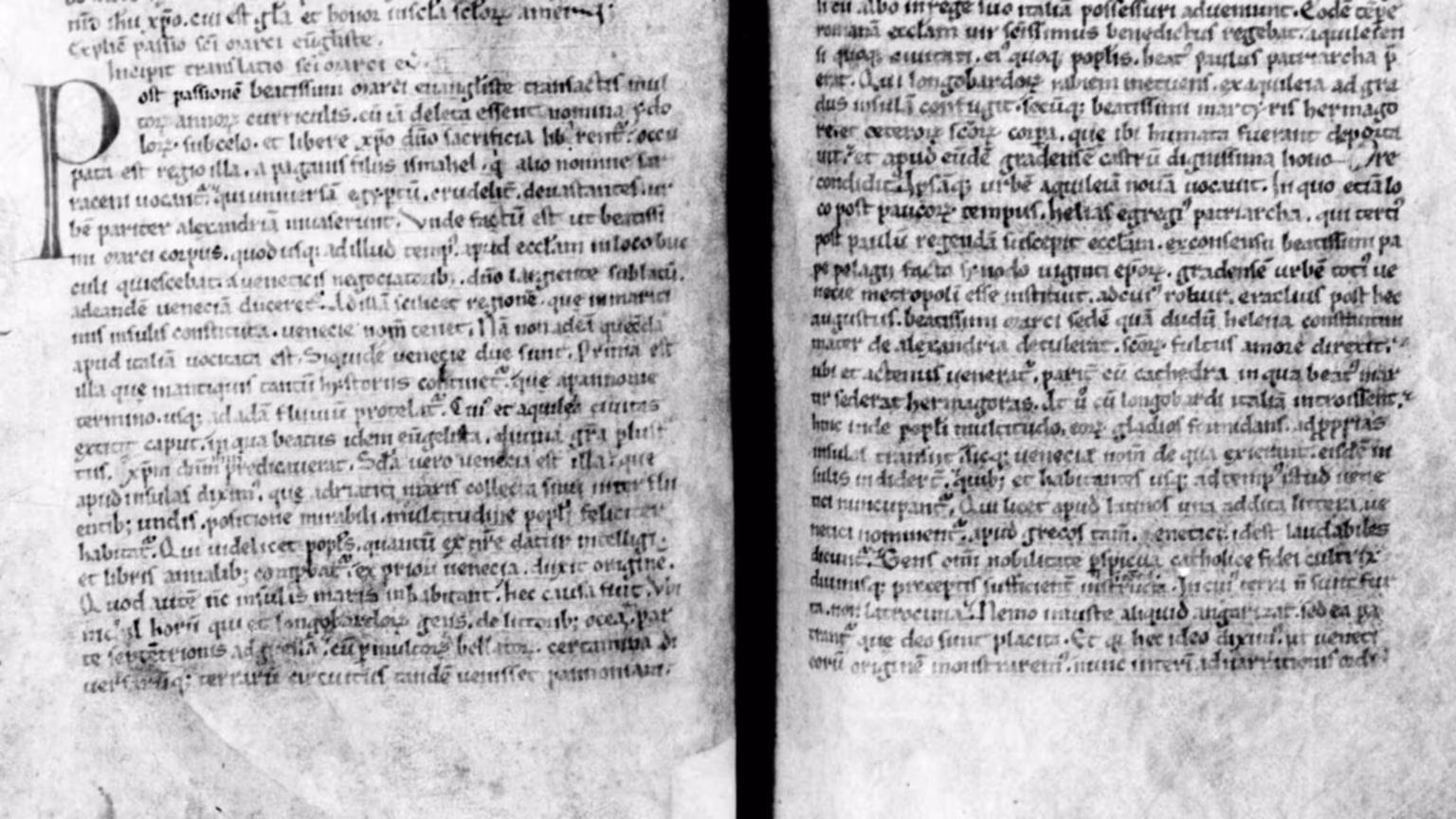 Parts of the page of a medieval manuscript with the start of the Translatio Marci Evangelistae Venetias.